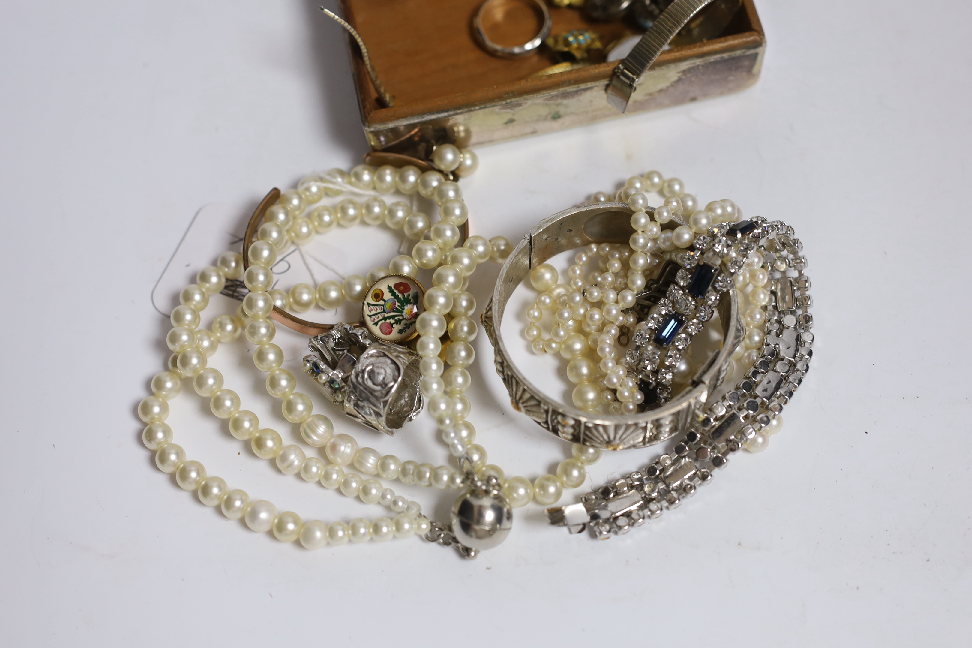 A double strand graduated cultured pearl necklace, with paste set white metal clasp, 44cm, a pair of 9ct and cultured pearl ear clips and a small quantity of assorted costume jewellery including two colour paste set brac